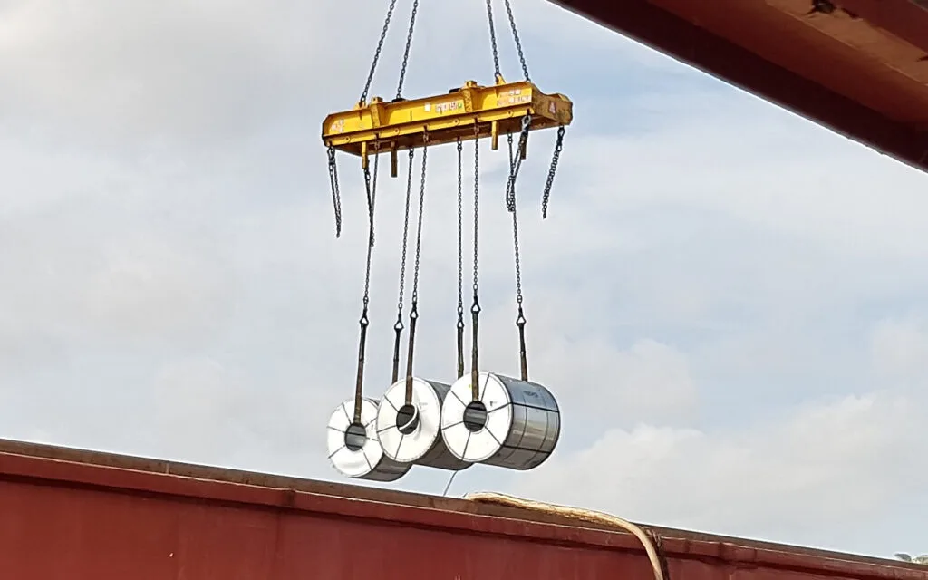 3 steel coils lifted in the air